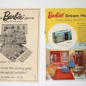 May include: Two vintage paper advertisements featuring The Barbie Game and Barbie's Dream House. The left print shows a board game with cards and a game board. The right print displays a yellow background with a dollhouse interior and furniture.