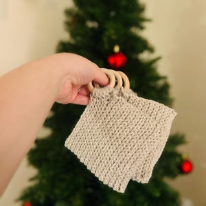 May include: A set of three ceramic mugs with a speckled, matte finish. The mugs are in shades of cream, light gray, and dark gray. Each mug has a simple, minimalist design, perfect for coffee or tea.