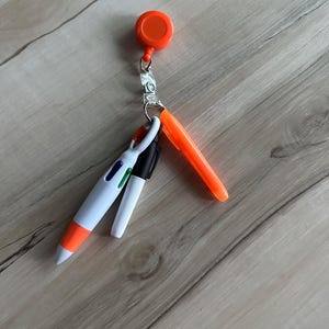 Pen, highlighter, dry marker with badge reel/holder