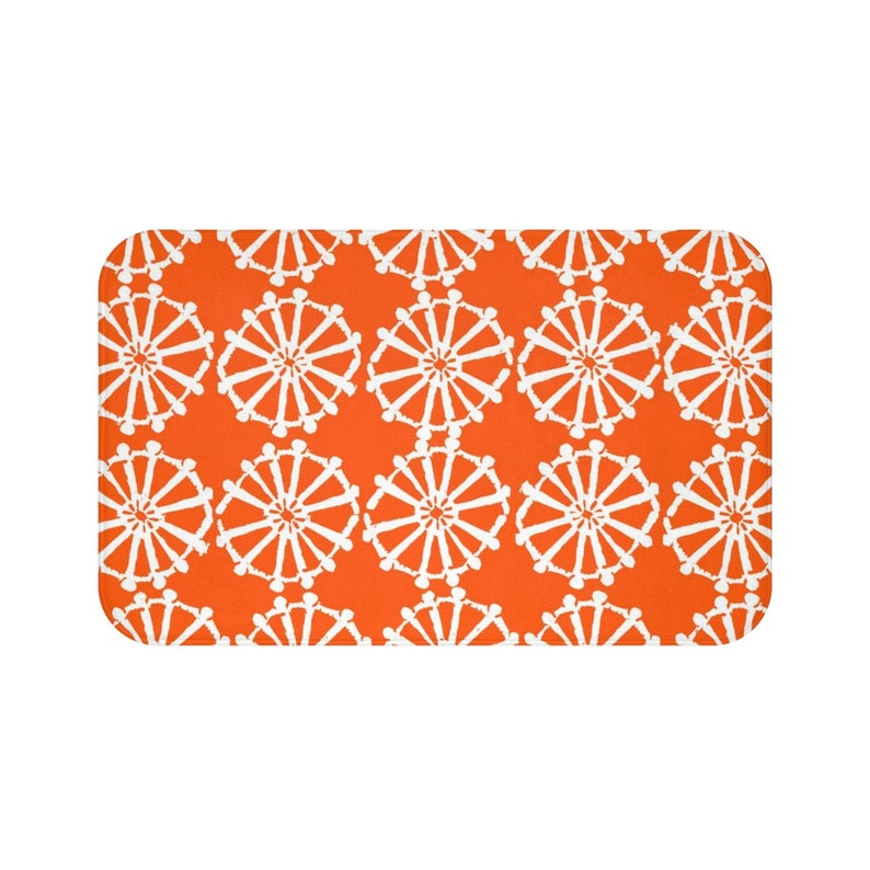 Orange Bath Mat And White Wheel Bathroom