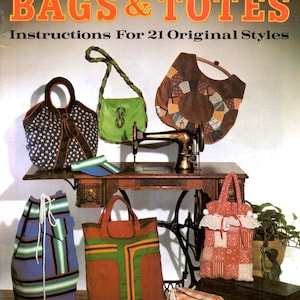 May include: A vintage sewing pattern book titled "Easy to Sew BAGS & TOTES" with instructions for 21 original styles. The image showcases various handmade bags, including a drawstring bag, tote bags, and a patchwork bag, alongside a vintage sewing machine.