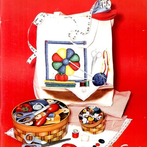 May include: A book cover titled "Realistic Illusions" by Marsha Weiser, featuring a white tote bag with sewing-themed illustrations. The image includes scissors, spools of thread, buttons, and a measuring tape against a red background.
