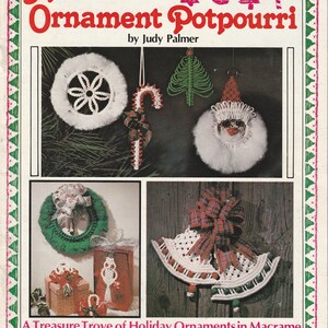 May include: A craft instruction book titled Macrame Ornament Potpourri by Judy Palmer featuring various macrame holiday ornaments including a white wreath, candy cane, green tree, Santa face, green wreath, and white bells with plaid bows.