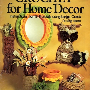 May include: A vintage book cover titled "CROCHET for Home Decor" with various crochet projects. The image showcases a crochet mirror frame, a raccoon, and several crochet baskets and planters. The color palette includes green, orange, and brown.