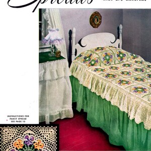 May include: Vintage magazine cover featuring a bed with a crocheted spread and a matching table skirt. The spread is white with floral motifs and a scalloped edge. Text reads "Spreads that are different" and "in Motifs easy to make."