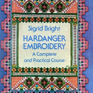 May include: A book cover for "Sigrid Bright Hardanger Embroidery: A Complete and Practical Course." The cover features a detailed, colorful embroidered design with a pink, blue, orange, and green border on a blue background.