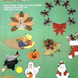 May include: A green book cover titled "Holiday Decorating With..." featuring various holiday-themed magnetic sheeting designs. Designs include a turkey, gingerbread men, a bow, a cornucopia, a witch, a pumpkin, a ghost, bells, a stocking, and Santa.