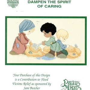 May include: Cross-stitch design featuring three children in pastel clothing, working together. The text "NOTHING CAN DAMPEN THE SPIRIT OF CARING" is displayed above the image. The design is sponsored by Sam Butcher for Flood Victims Relief.