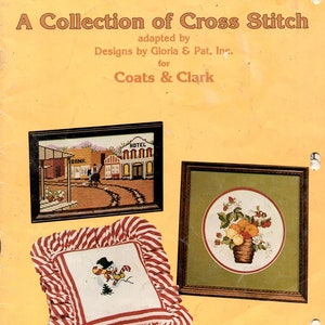 May include: A vintage book cover titled "A Collection of Cross Stitch" by Designs by Gloria & Pat, Inc. The cover features framed cross-stitch samplers, including a Western town scene, a floral arrangement, and a snowman. The book is for Coats & Clark.