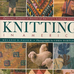 May include: A book cover titled "KNITTING IN AMERICA" with images of knitted items and people. The cover features a variety of knitted patterns, including geometric designs and textured fabrics. The book's subtitle reads "Patterns, Profiles & Stories of America's Leading Artisans."