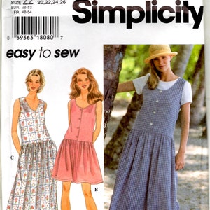 May include: Simplicity pattern 9596 for a sleeveless dress with a drop waist and button-front closure. The pattern envelope displays three variations: a long floral print dress, a short solid pink dress, and a long blue plaid dress.