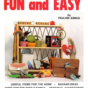 May include: A vintage book cover with the text "Plastic Canvas is... FUN and EASY" in red. The image showcases various plastic canvas crafts, including bags, boxes, and decorative items, arranged on a wooden shelf.