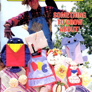 May include: Cover of Annie's Pattern Club magazine, Number 34, featuring a scarecrow and various handmade crafts. The crafts include an apron, a clock, and stuffed animals. The text reads "Something to Crow About!"