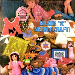 May include: Cover of Annie's Pattern Club magazine, issue 35, featuring various needlecraft projects. The image includes a girl, a variety of handmade items like dolls, blankets, and decorative pieces, and the text "GRADE 'A' NEEDLECRAFT!"