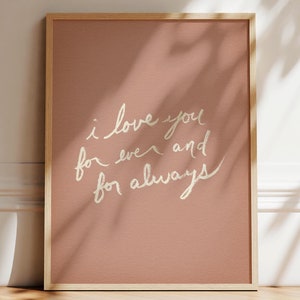 May include: A framed print with a pink background and white text that reads "i love you for ever and for always".