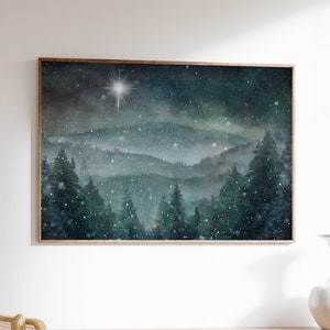 A snowy pine mountain painting wall art print for your winter home décor. Featuring soft snow and the north star, or star of Bethlehem.