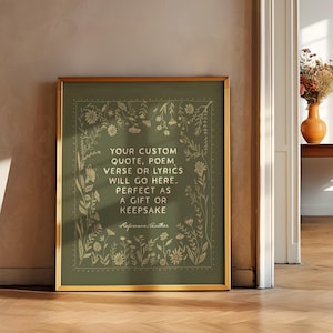 May include: A framed print with a gold border, featuring a green background with floral designs. The text reads, "YOUR CUSTOM QUOTE, POEM, VERSE OR LYRICS WILL GO HERE. PERFECT AS A GIFT OR KEEPSAKE."