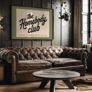 Playful typography art print celebrating the joy of staying in with “The Homebody Club” design.