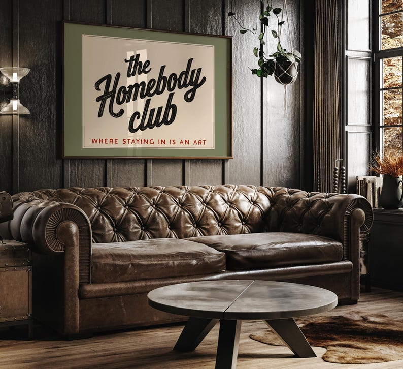 Playful typography art print celebrating the joy of staying in with “The Homebody Club” design.