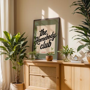 Cozy wall art featuring “Live Laugh Lounge” quote