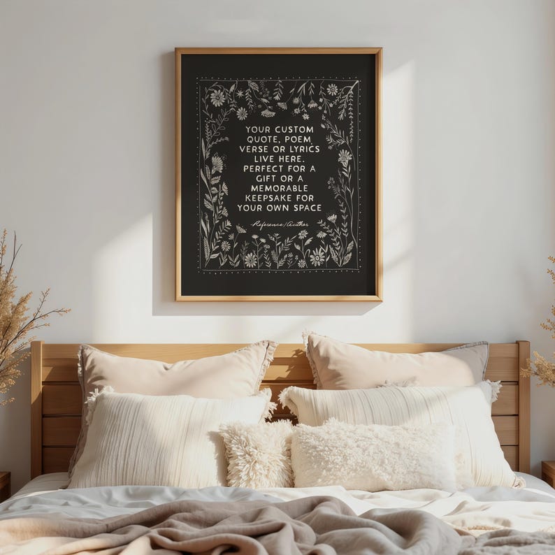 May include: A framed black print with white floral illustrations and text. The text reads: "YOUR CUSTOM QUOTE, POEM, VERSE OR LYRICS LIVE HERE. PERFECT FOR A GIFT OR A MEMORABLE KEEPSAKE FOR YOUR OWN SPACE."