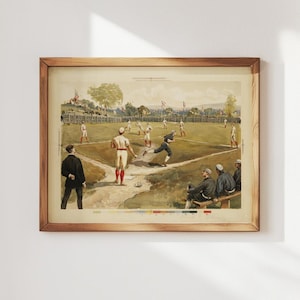 May include: A framed vintage baseball print. The artwork depicts a baseball game in progress, with players in period uniforms on a green field. The print is in a wooden frame, showcasing a classic sports theme.
