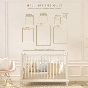 May include: Wall art size guide with dimensions in inches and centimeters, shown to scale with a 54-inch crib. Includes sizes like 11x14 in, 12x12 in, 20x30 in, 20x24 in, 16x20 in, and 5x7 in. The guide is displayed on a cream-colored wall.