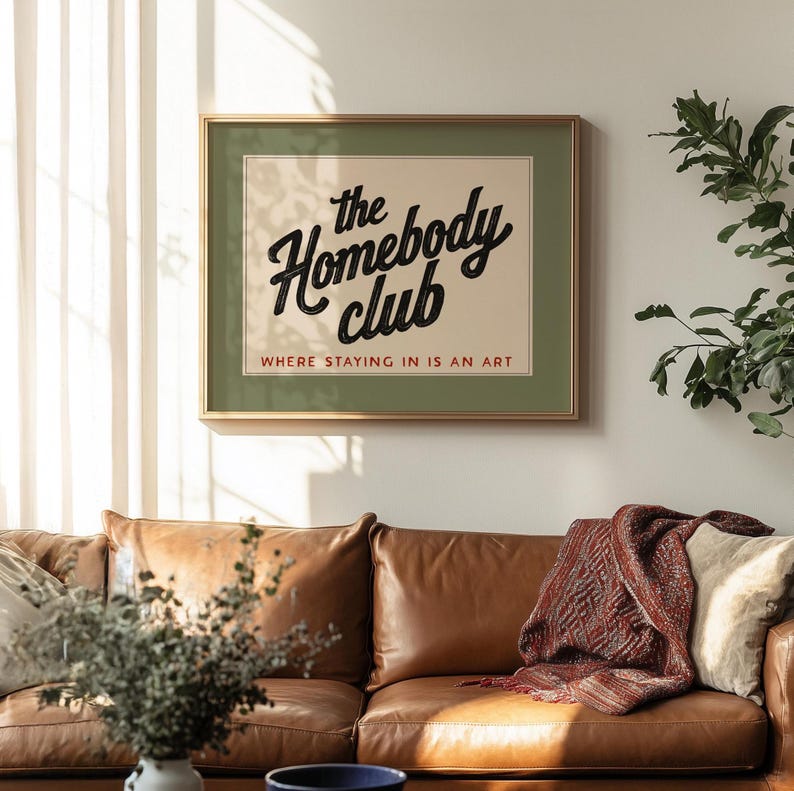 Cozy quote print for introverts featuring “The Homebody Club” in decorative typography.