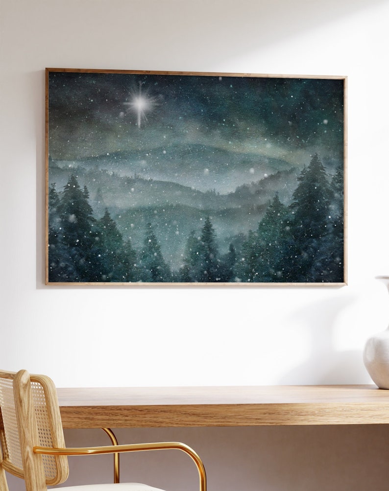 A snowy pine mountain painting wall art print for your winter home décor. Featuring soft snow and the north star, or star of Bethlehem.