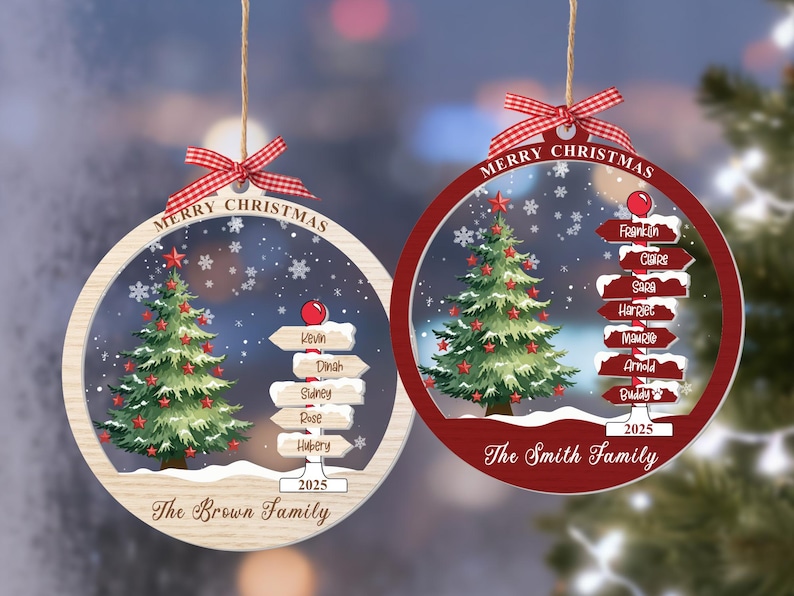 May include: Two round Christmas ornaments with a red and white gingham bow. Each features a green Christmas tree, a snowy signpost with names, the text Merry Christmas, 2025, and family names. One ornament has a light wood frame, the other red.