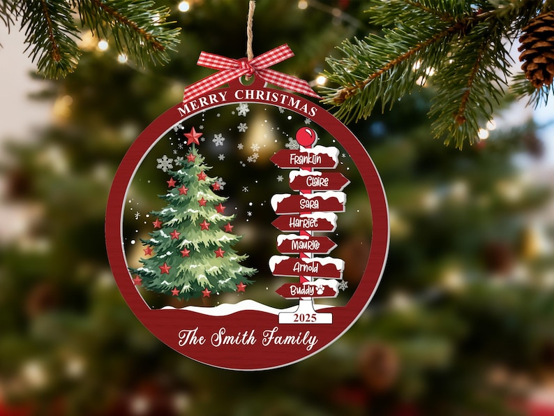 May include: A round, red-bordered Christmas ornament featuring a green tree with red stars, a signpost with names Franklin, Claire, Sara, Harriet, Maurice, Arnold, and Buddy, the text Merry Christmas, 2025, and The Smith Family, topped with a red plaid bow.