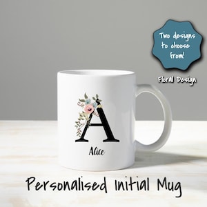 May include: White ceramic mug with a black letter "A" and floral design. The mug has the name "Alice" below the letter. Text on the mug reads "Personalised initial Mug" and "Two designs to choose from! Floral Design".
