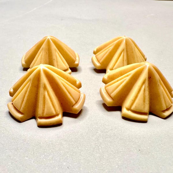 Vintage set of four carved pyramid shaped celluloid buttons