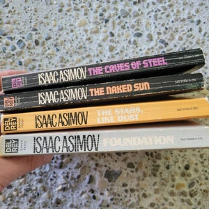 Isaac Asimov Paperback Books The Caves of Steel, The Naked Sun, Foundation and The Stars, Like Dust