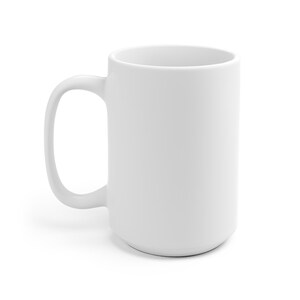 May include: A white ceramic mug with a large handle. The mug is empty and has a smooth, matte finish.
