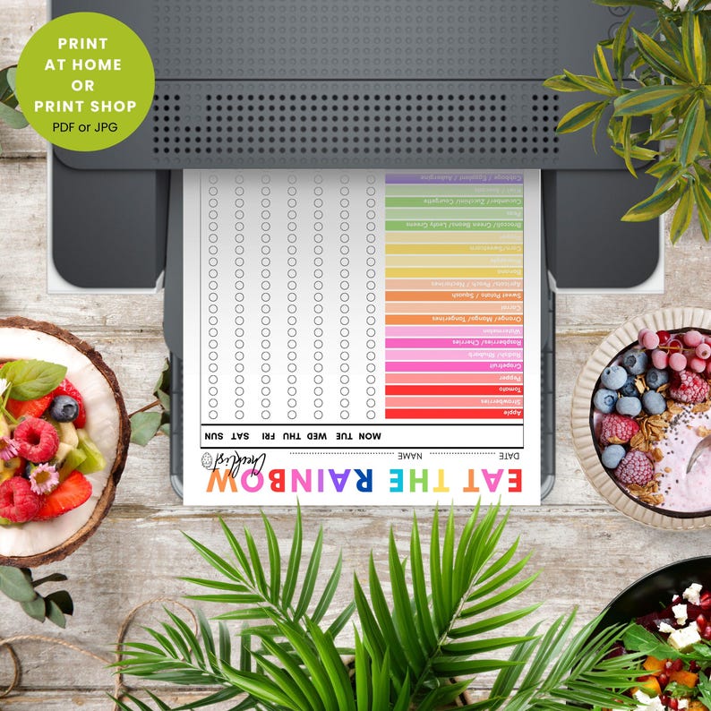 May include: A printed checklist titled "EAT THE RAINBOW" with colorful food categories and check boxes. The print is coming out of a printer. The image includes a bowl of fruit and a coconut shell with fruit.