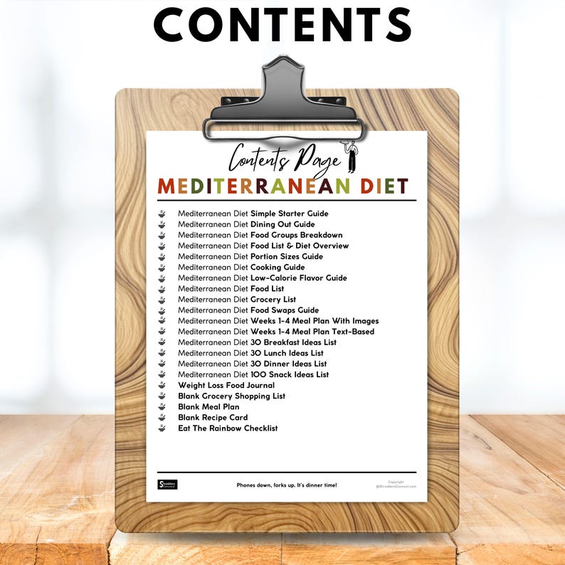 May include: A clipboard with a wooden background holds a contents page for a Mediterranean diet plan. The page lists various guides, meal plans, and checklists, including a simple starter guide, food lists, and recipe cards. The title "MEDITERRANEAN DIET" is prominently displayed.