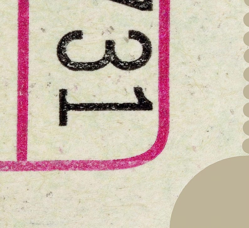 May include: Close-up of a postage stamp fragment. The stamp features the number "31" in black, set against a light background. A vibrant pink border frames the left side and bottom of the number.
