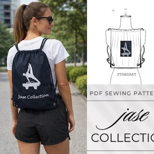 May include: A navy blue drawstring backpack with a white gymnast graphic and the text "Jase Collection". The backpack is worn by a person wearing a white t-shirt and black shorts. The background shows a blurred outdoor scene.