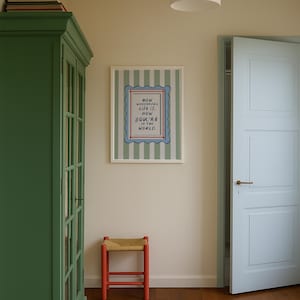 A timeless How Wonderful Life Is Now You’re In the World nursery print in soft sage green tones with classic stripes and a vintage circus feel. Perfect for playroom wall art, kids wall art, and baby room wall decor. This heartfelt nursery quote print adds warmth and meaning to any space, pairing beautifully with sage green nursery art and traditional circus nursery themes. Ideal for parents who love vintage playroom art and storybook-inspired design.