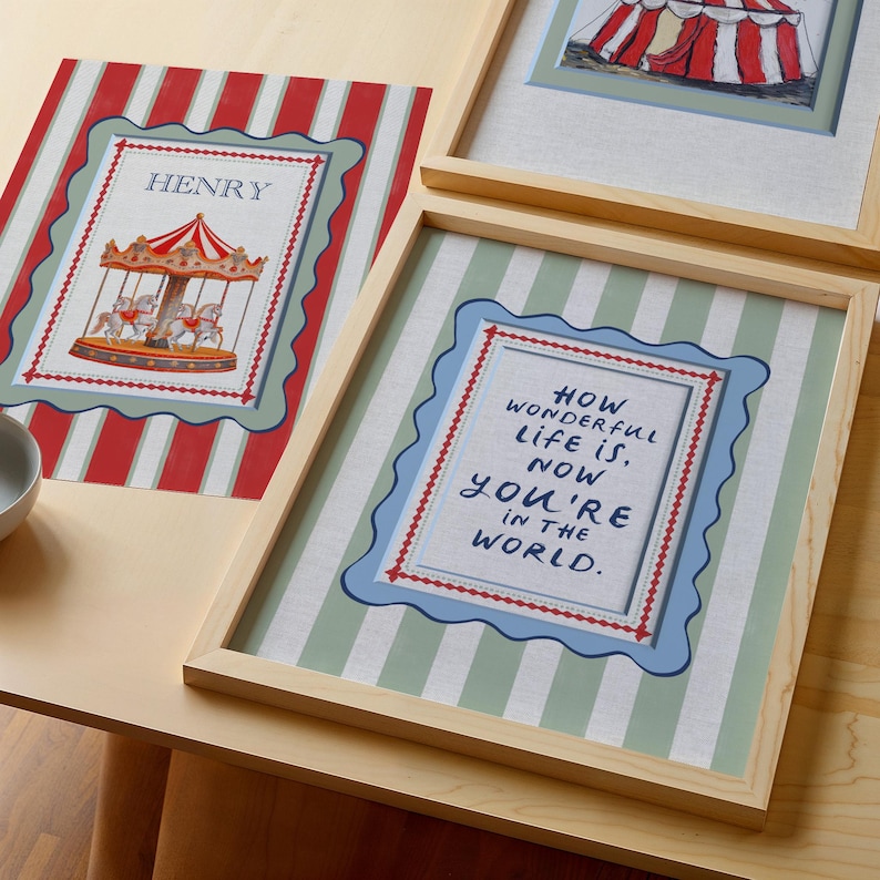 A timeless How Wonderful Life Is Now You’re In the World nursery print in soft sage green tones with classic stripes and a vintage circus feel. Perfect for playroom wall art, kids wall art, and baby room wall decor. This heartfelt nursery quote print adds warmth and meaning to any space, pairing beautifully with sage green nursery art and traditional circus nursery themes. Ideal for parents who love vintage playroom art and storybook-inspired design.