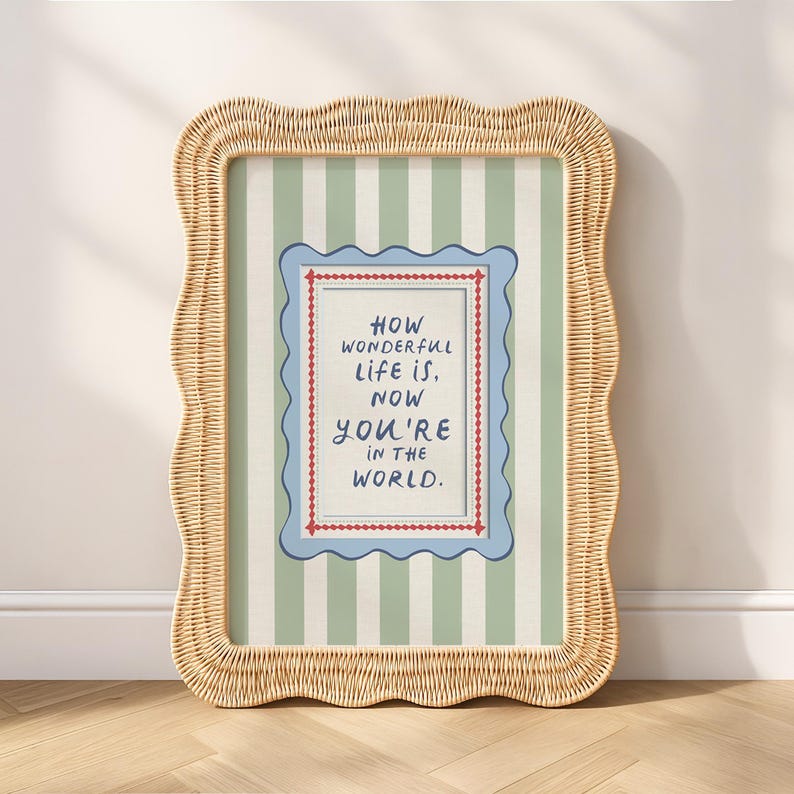 A timeless How Wonderful Life Is Now You’re In the World nursery print in soft sage green tones with classic stripes and a vintage circus feel. Perfect for playroom wall art, kids wall art, and baby room wall decor. This heartfelt nursery quote print adds warmth and meaning to any space, pairing beautifully with sage green nursery art and traditional circus nursery themes. Ideal for parents who love vintage playroom art and storybook-inspired design.