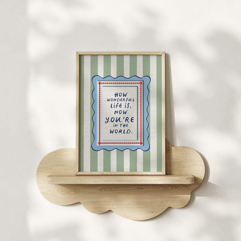 A vintage-inspired How Wonderful Life Is Now You’re In the World nursery print in soft sage green stripes — a beautiful affirmation for children and a perfect DIY nursery art idea. This positive quote print encourages joy and self-worth while adding warmth to any playroom or baby room. Ideal for parents creating mindful kids spaces, handmade playroom wall art, or sage green nursery decor with a storybook, circus-inspired touch.