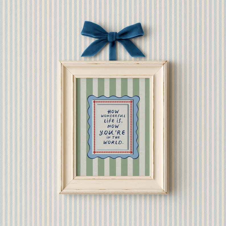 A vintage-inspired How Wonderful Life Is Now You’re In the World nursery print in soft sage green stripes — a beautiful affirmation for children and a perfect DIY nursery art idea. This positive quote print encourages joy and self-worth while adding warmth to any playroom or baby room. Ideal for parents creating mindful kids spaces, handmade playroom wall art, or sage green nursery decor with a storybook, circus-inspired touch.