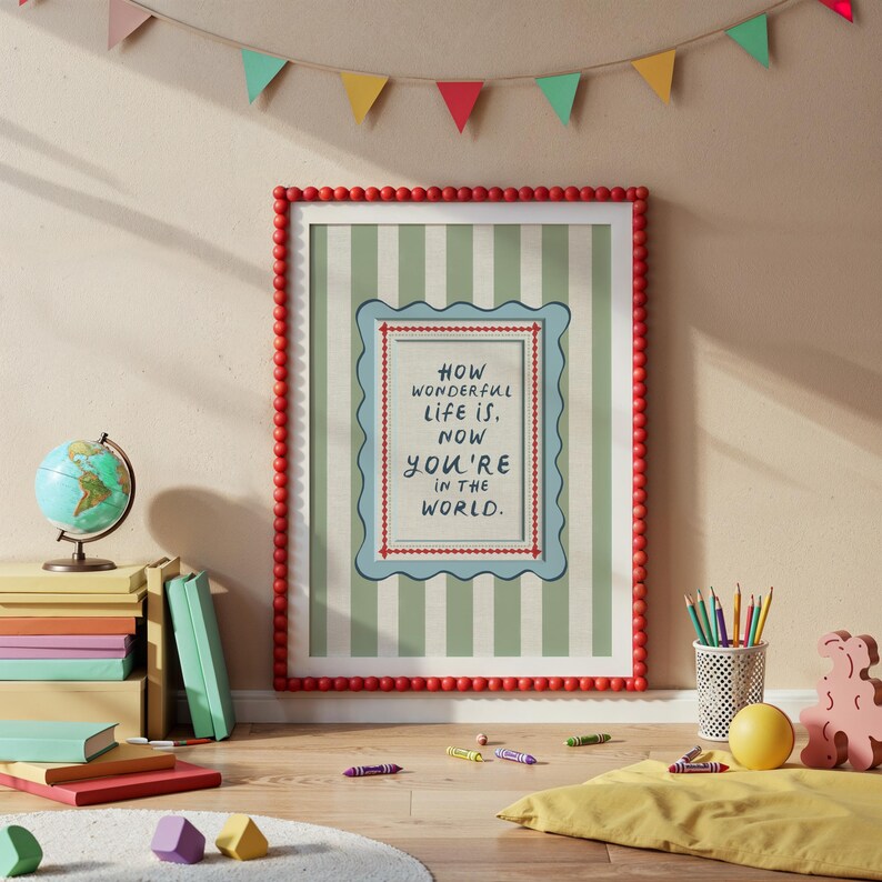 A vintage-inspired How Wonderful Life Is Now You’re In the World nursery print in soft sage green stripes — a beautiful affirmation for children and a perfect DIY nursery art idea. This positive quote print encourages joy and self-worth while adding warmth to any playroom or baby room. Ideal for parents creating mindful kids spaces, handmade playroom wall art, or sage green nursery decor with a storybook, circus-inspired touch.
