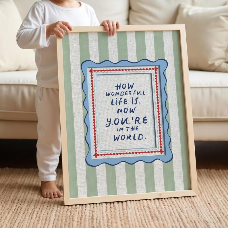 A whimsical quote print featuring an eclectic, playful font that adds character and charm. The text is framed by a distinctive squiggle border, giving it a handcrafted, storybook feel. Behind the design, soft mint green stripes create a fresh yet vintage-inspired backdrop, perfect for adding a touch of personality to a nursery or eclectic home decor. A delightful blend of classic and quirky, this print makes a charming statement piece with timeless appeal.