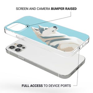 May include: A clear phone case with a raised bumper for added protection. The case features a graphic of a white and gray husky dog on a light blue background. The text "SCREEN AND CAMERA BUMPER RAISED" is printed on the case. The case also features the text "FULL ACCESS TO DEVICE PORTS".