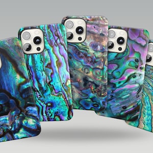 May include: Five phone cases with a vibrant, iridescent abalone shell design. The cases display a mix of blues, greens, purples, and hints of gold. Each case has a camera cutout and a sleek, modern appearance.