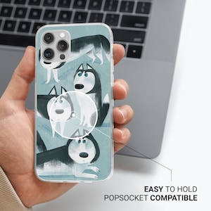 May include: A clear phone case with a blue background and a pattern of four cartoon husky dogs. The dogs are in various poses and have different expressions. The case is compatible with a popsocket.
