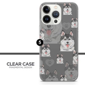 May include: Clear phone case with a fragmented design featuring a repeating pattern of grey and white husky dogs on a grey background. The case has a clear back and a white border.